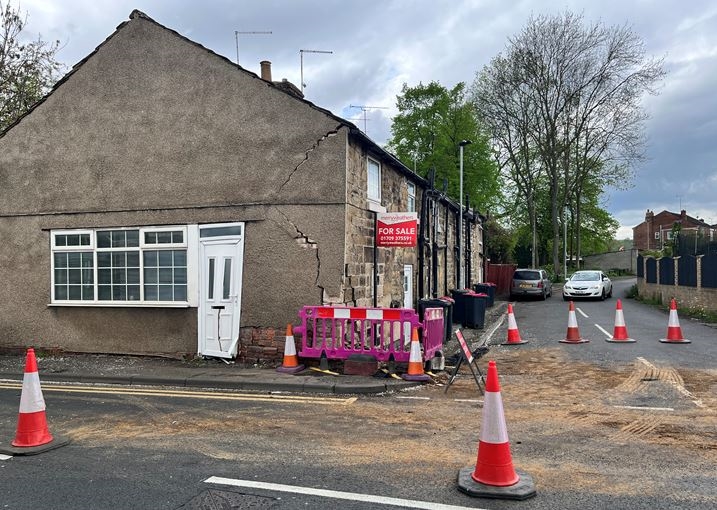 Road partly closed in Rotherham after car crashes into house in